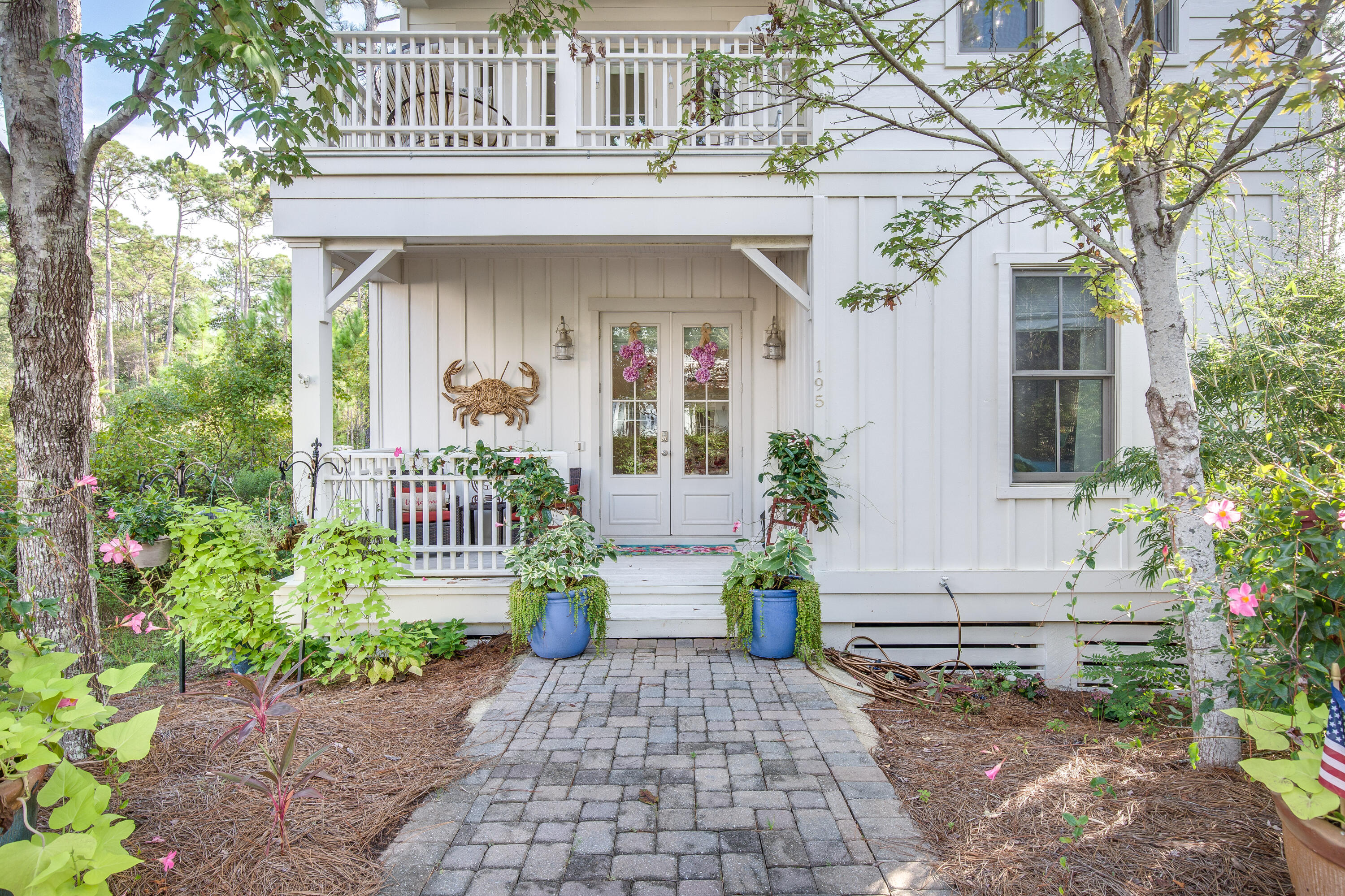 195 Redbud Lane Inlet Beach, FL 32461 - Photo 1 of 24 a front view of a house with a porch