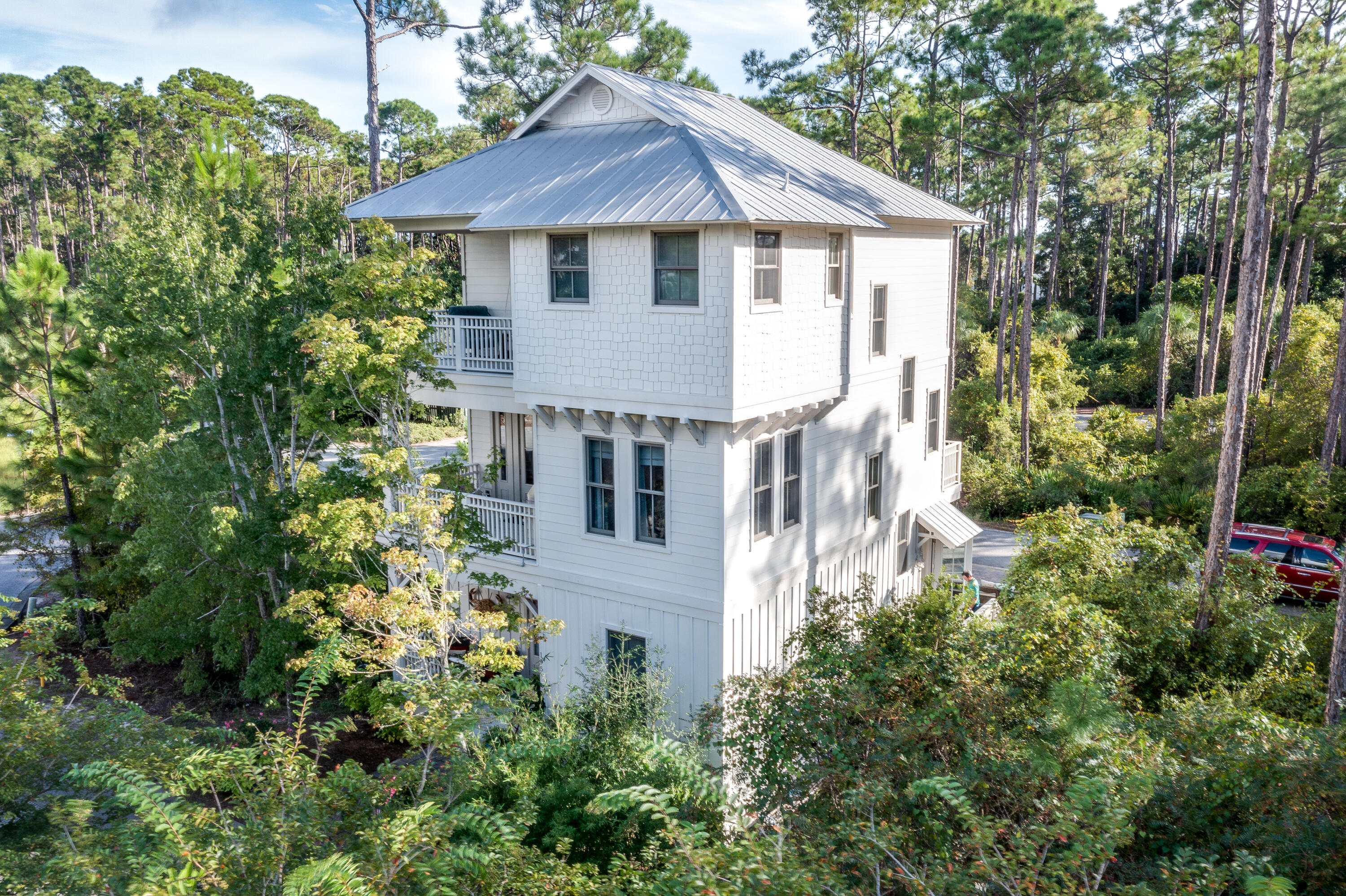 195 Redbud Lane Inlet Beach, FL 32461 - Photo 2 of 24 a view of a house with brick walls and potted plants