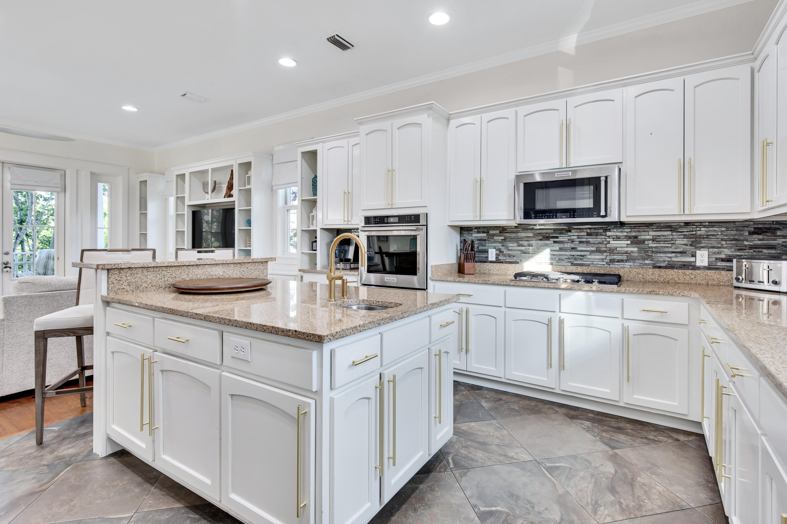 195 Redbud Lane Inlet Beach, FL 32461 - Photo 12 of 24 a kitchen with kitchen island granite countertop white cabinets white stainless steel appliances with a sink and dishwasher