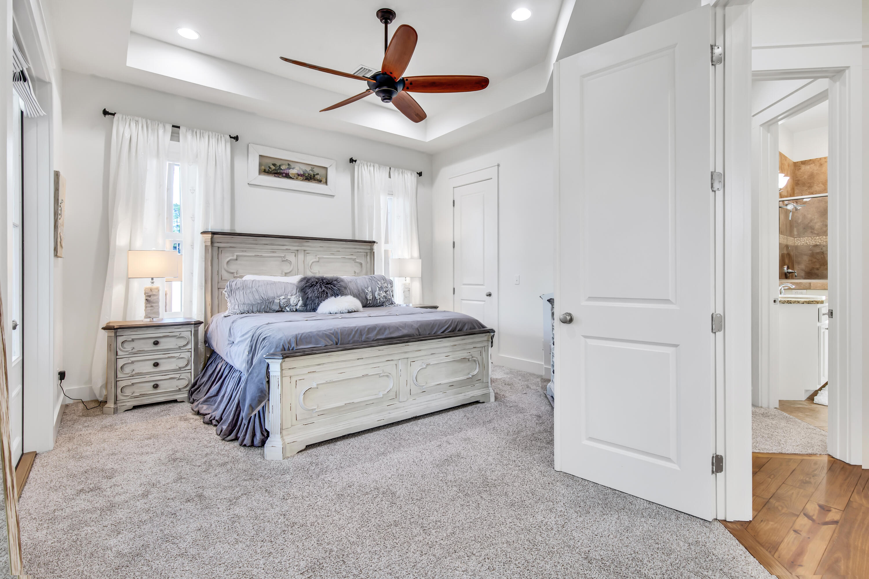 195 Redbud Lane Inlet Beach, FL 32461 - Photo 15 of 24 a bedroom with a bed and a chandelier