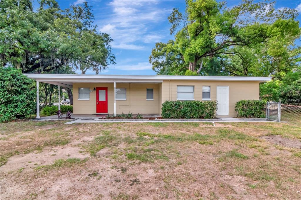 126 Kingsway Road Brandon, FL 33510 - Photo 2 of 42 a view of a house with backyard and trees