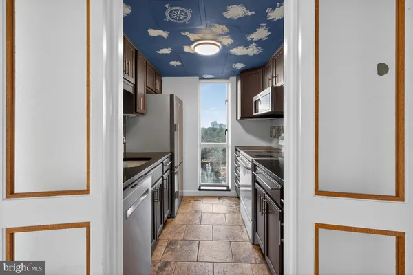 a view of a hallway with a chandelier