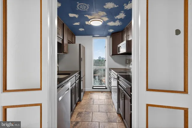 a view of a hallway with a chandelier