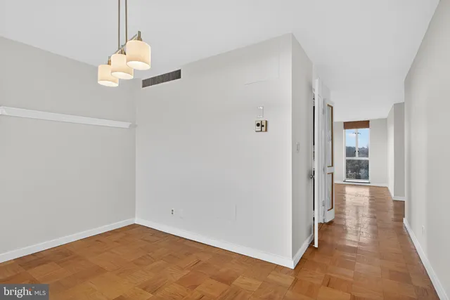 a view of an empty room and window