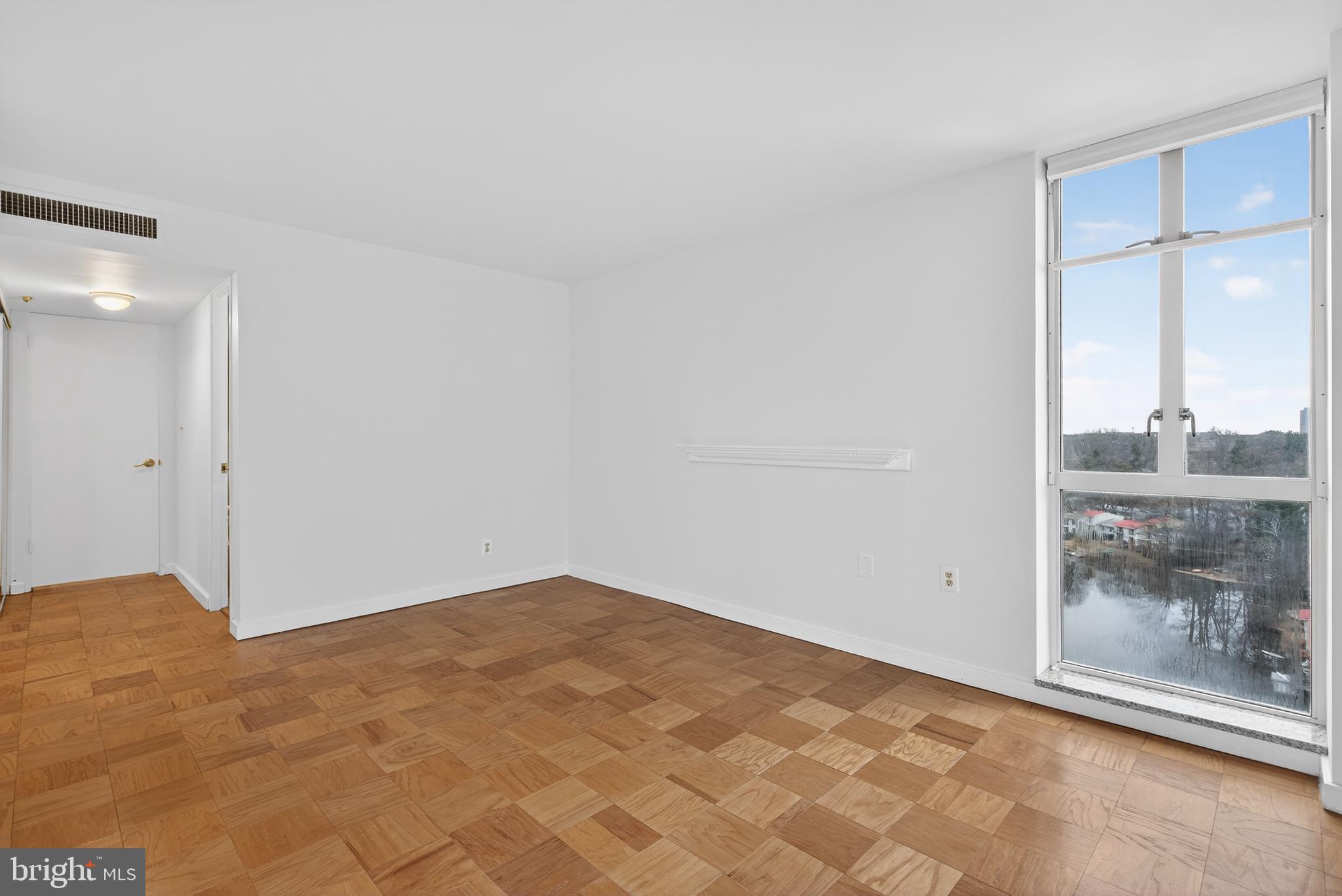 11400 Washington Plaza West, Unit 1303 Reston, VA 20190 - Photo 22 of 34 a view of an empty room with a window