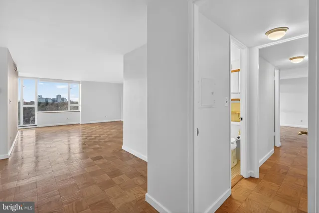 a view of a kitchen with a sink and a window