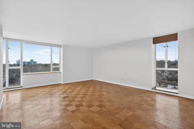 a view of an empty room with a window