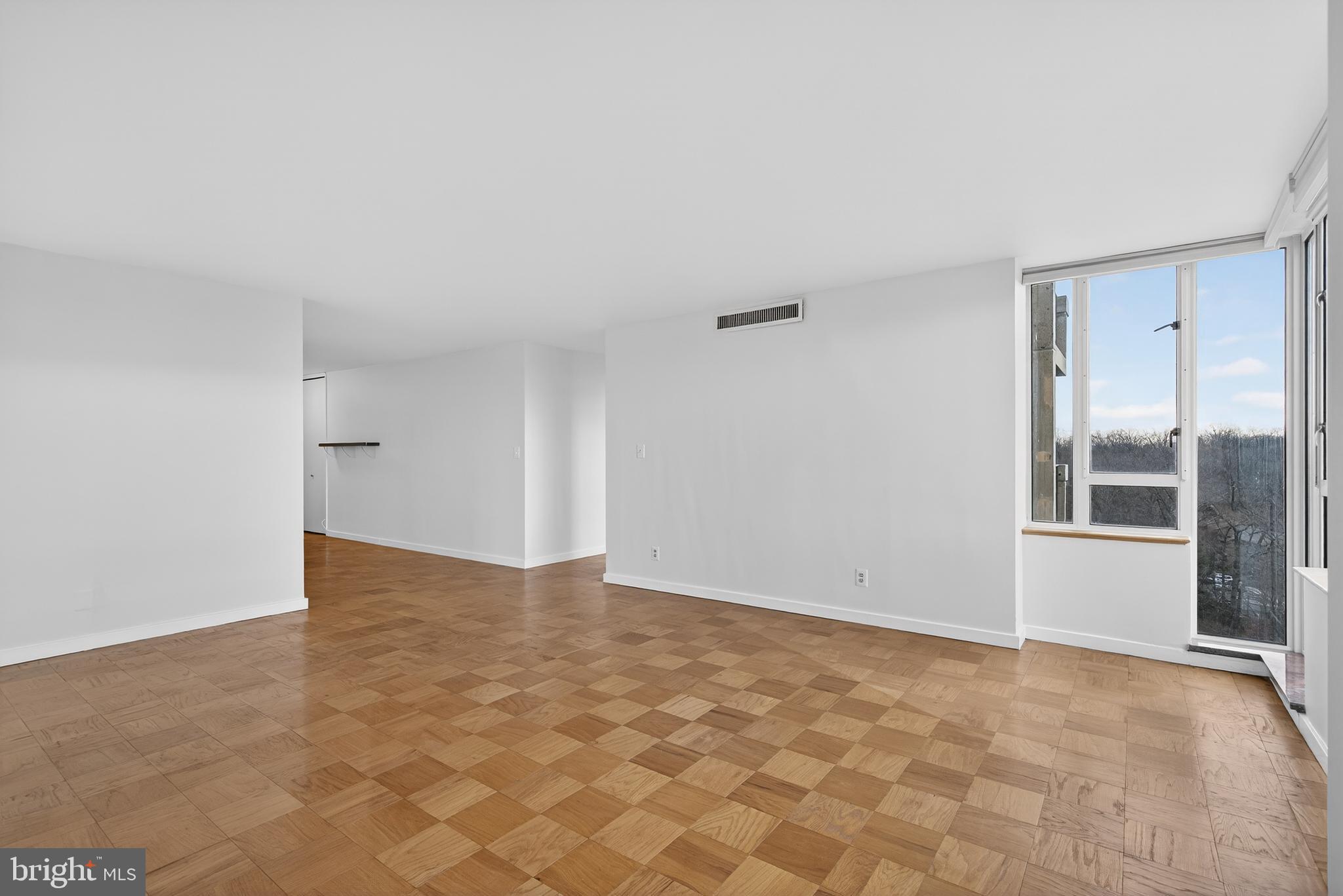 11400 Washington Plaza West, Unit 1303 Reston, VA 20190 - Photo 7 of 34 a view of an empty room with a window