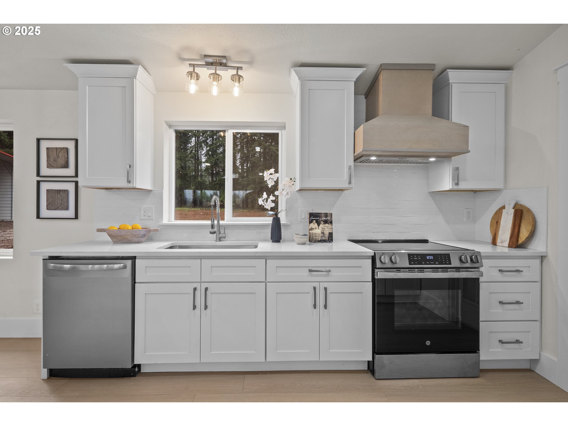 15776 South Pierce Road Molalla, OR 97038 - Photo 12 of 29 a kitchen with stainless steel appliances granite countertop a stove and white cabinets