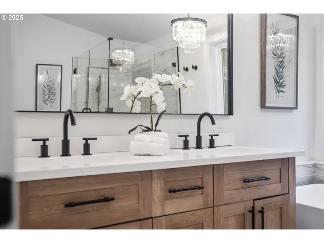 a bathroom with a sink double vanity and a mirror