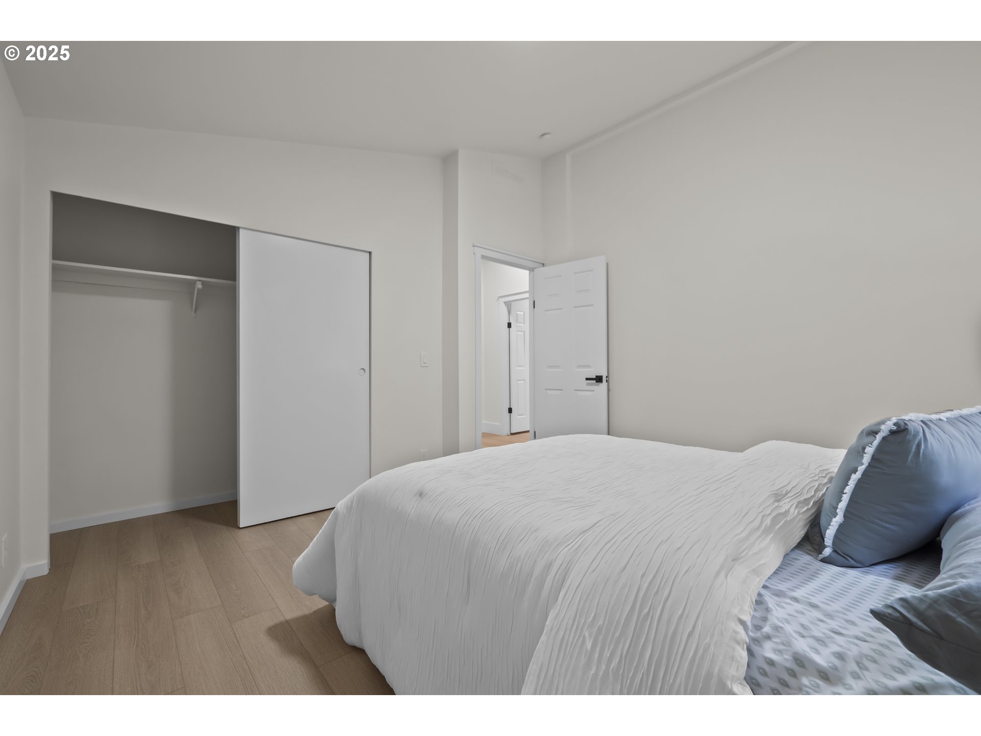 15776 South Pierce Road Molalla, OR 97038 - Photo 22 of 29 a bedroom with a bed and wooden floor