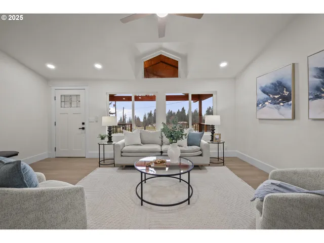 a living room with furniture and white walls