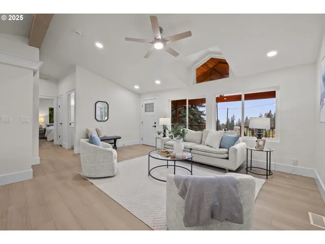 a living room with fireplace furniture and a wooden floor