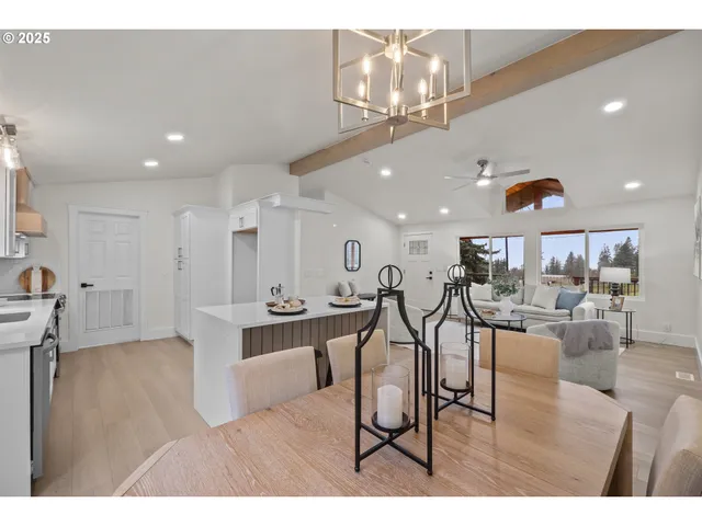 a living room with lots of furniture and kitchen view