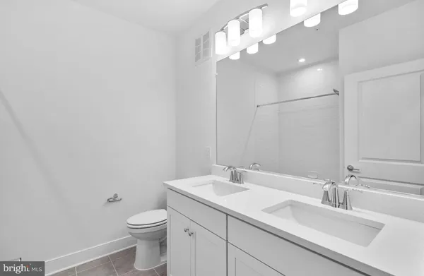 a bathroom with a white bath tub and a shower curtain