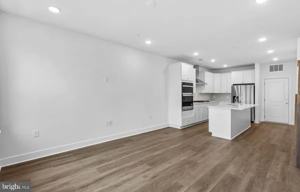 a view of kitchen with wooden floor