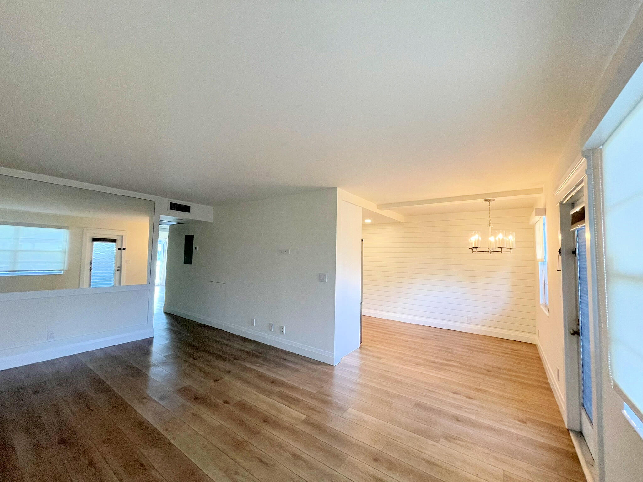 1030 Rexford B Boca Raton, FL 33434 - Photo 6 of 27 an empty room with wooden floor and windows