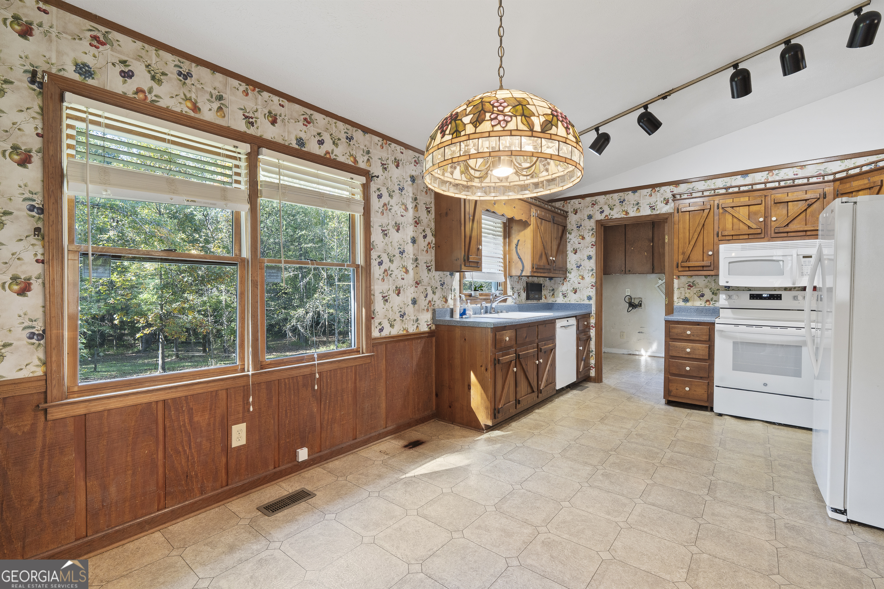 124 Coppergate Lane Macon, GA 31211 - Photo 20 of 46 a view of a kitchen with a refrigerator stove top oven cabinets