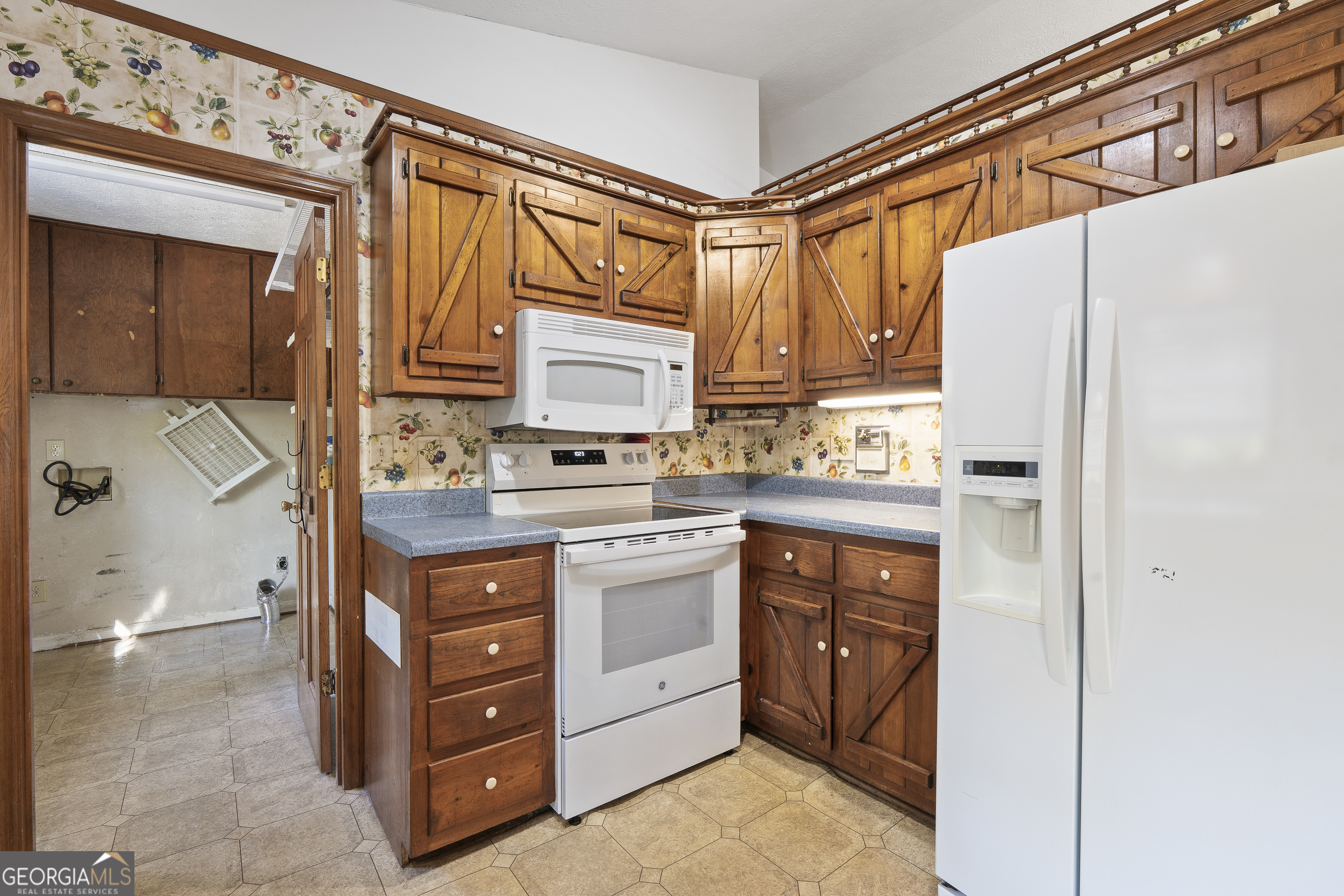 124 Coppergate Lane Macon, GA 31211 - Photo 23 of 46 a kitchen with stainless steel appliances a stove and a refrigerator