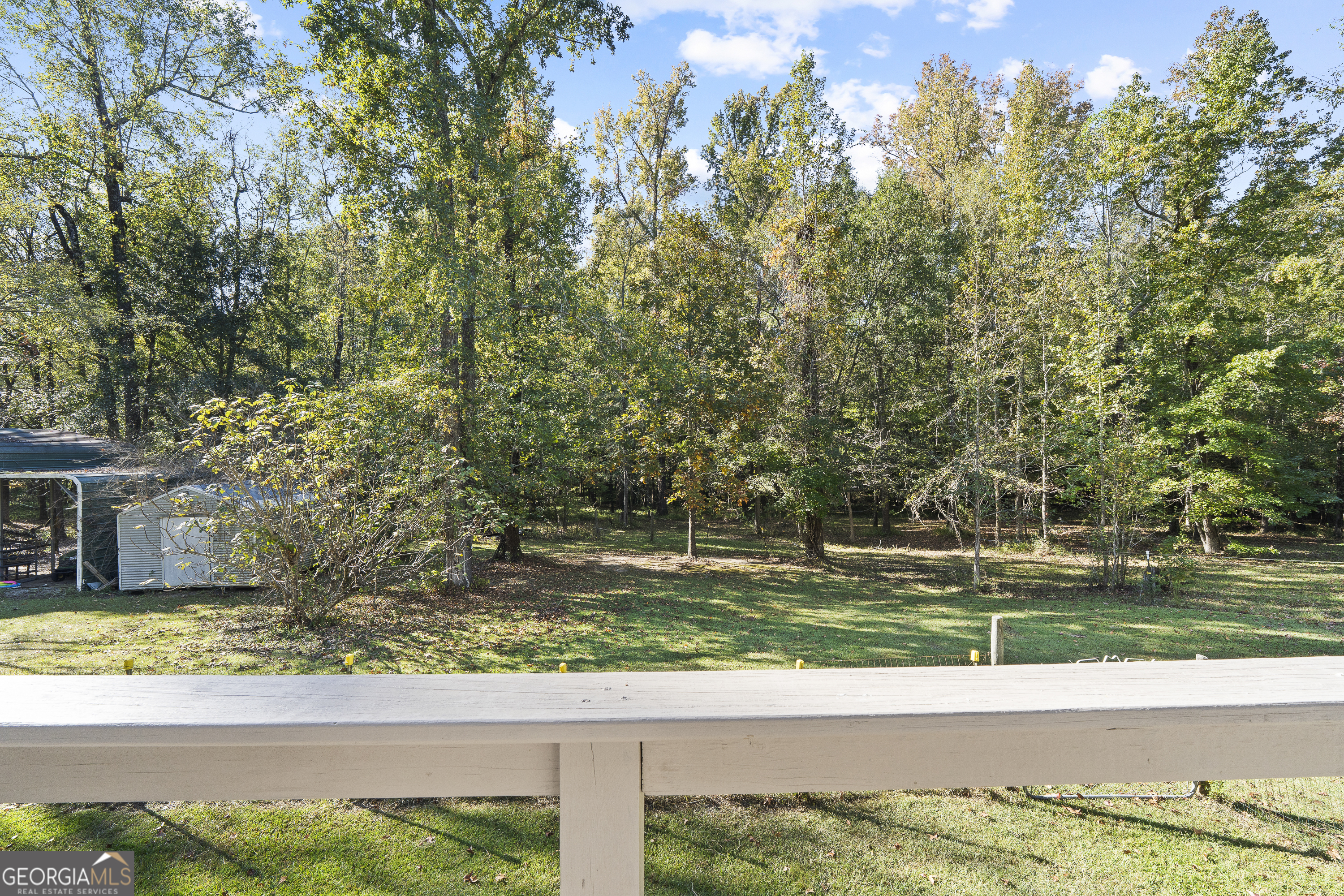 124 Coppergate Lane Macon, GA 31211 - Photo 42 of 46 a view of a yard with flower plants