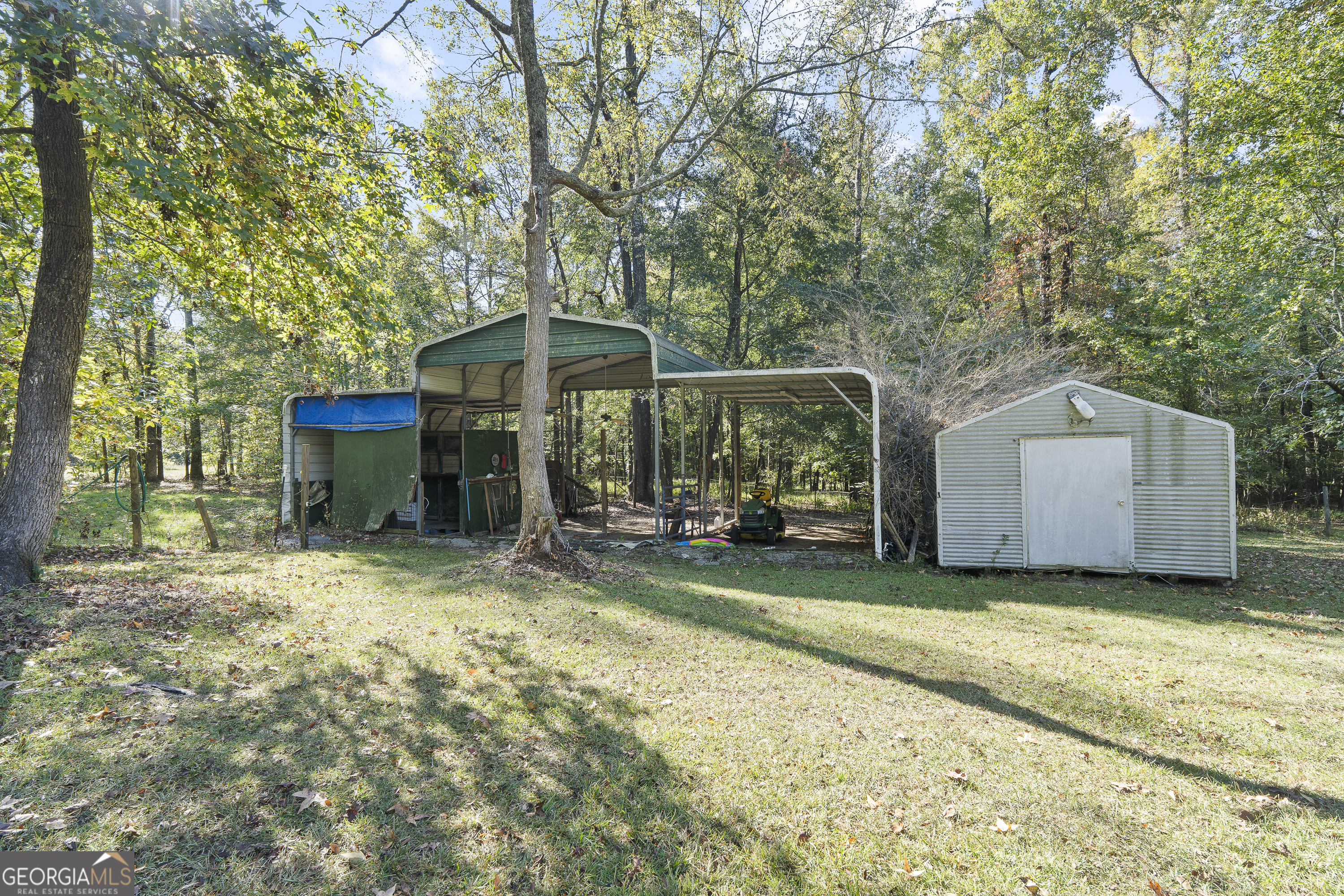 124 Coppergate Lane Macon, GA 31211 - Photo 46 of 46 a view of a house with a yard and large trees