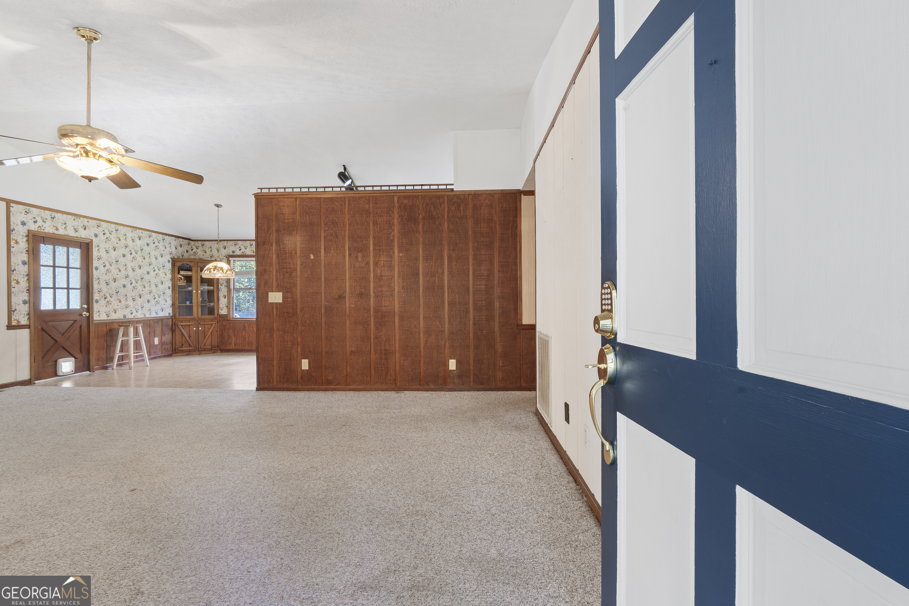 124 Coppergate Lane Macon, GA 31211 - Photo 9 of 46 a view of a living room with furniture and a chandelier