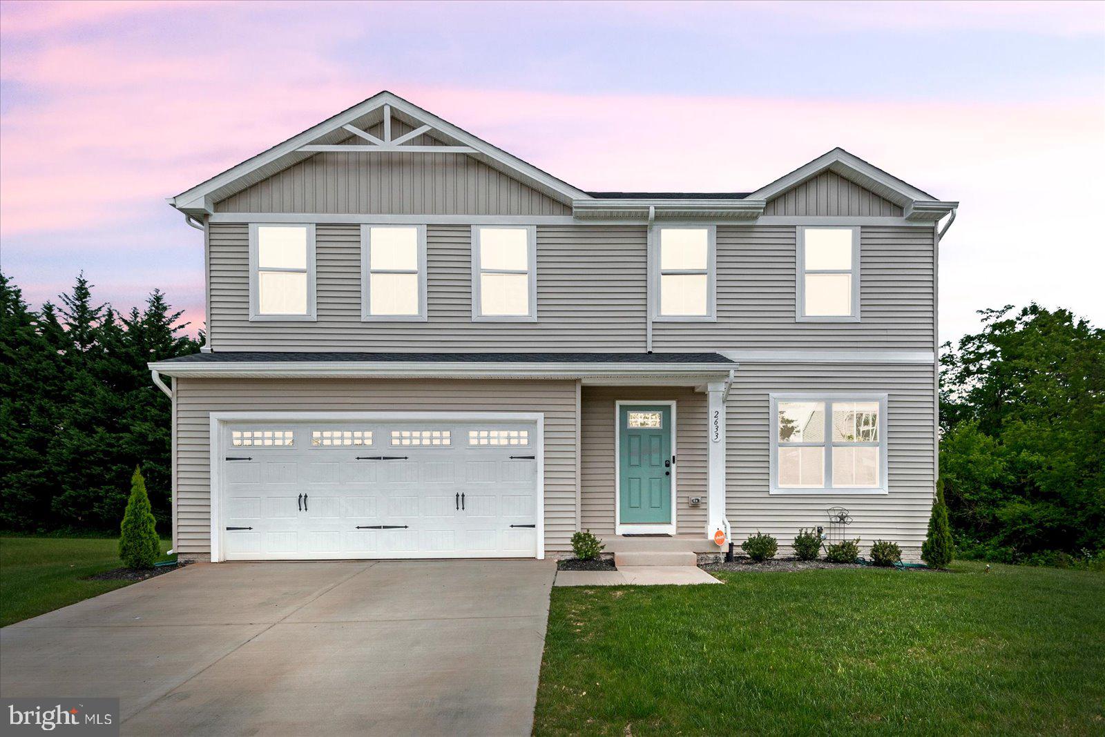 2633 High Point Drive Culpeper, VA 22701 - Photo 1 of 34 a front view of a house with a yard and garage