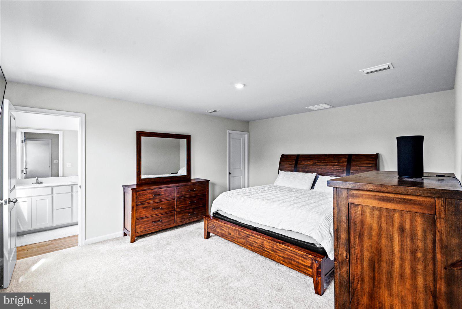2633 High Point Drive Culpeper, VA 22701 - Photo 14 of 34 a bedroom with a bed and wooden floor