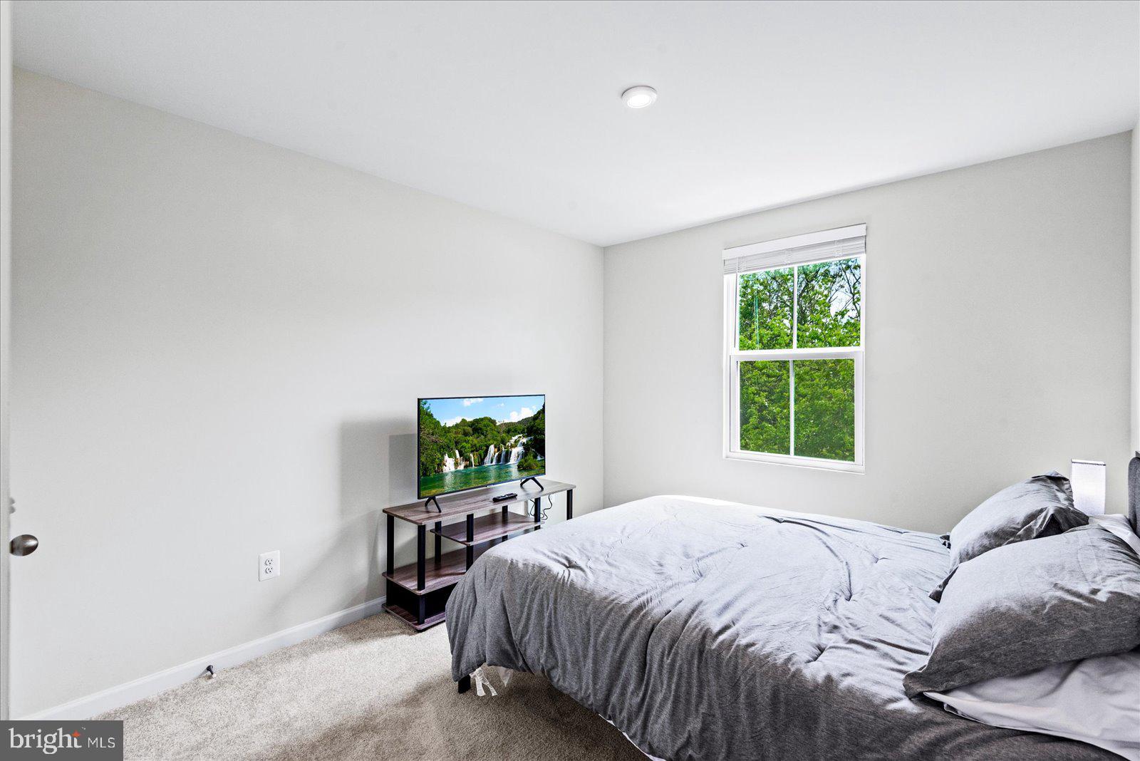 2633 High Point Drive Culpeper, VA 22701 - Photo 19 of 34 a bed sitting in a bedroom next to a window