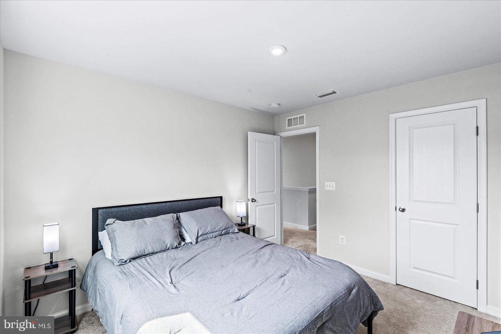 2633 High Point Drive Culpeper, VA 22701 - Photo 20 of 34 a bedroom with a bed and a night stand