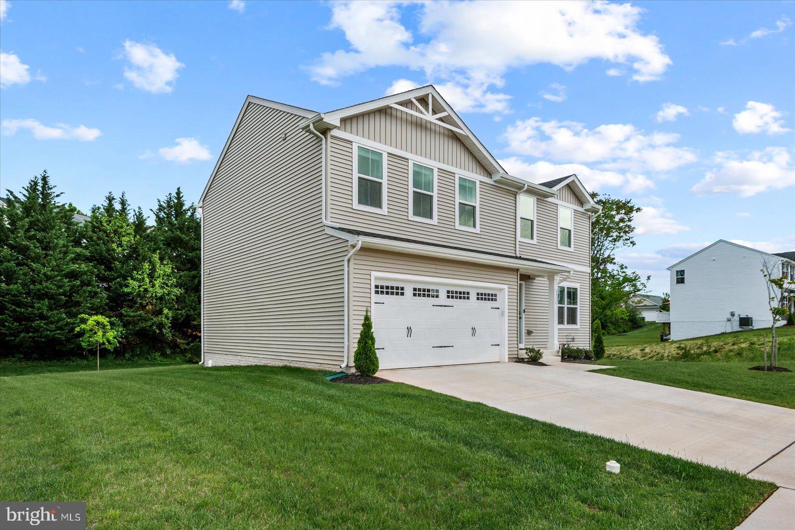 2633 High Point Drive Culpeper, VA 22701 - Photo 4 of 34 a front view of a house with a garden and yard