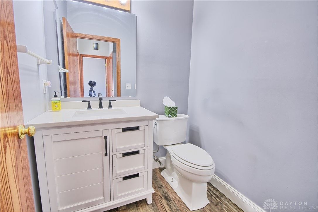 8711 Nicole Lane Springboro, OH 45066 - Photo 28 of 87 This bathroom features a contemporary vanity and toilet, offering both style and essential function.