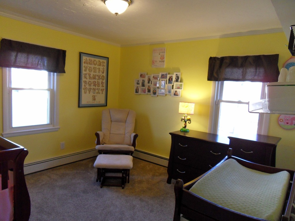 285 Thompson Road Webster, MA 01570 - Photo 13 of 20 a room with a desk chair and windows