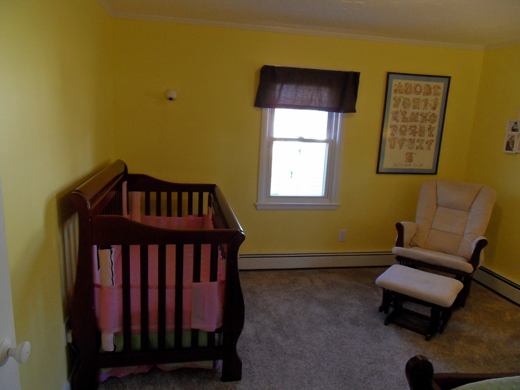 285 Thompson Road Webster, MA 01570 - Photo 14 of 20 a bedroom with a bed and a window