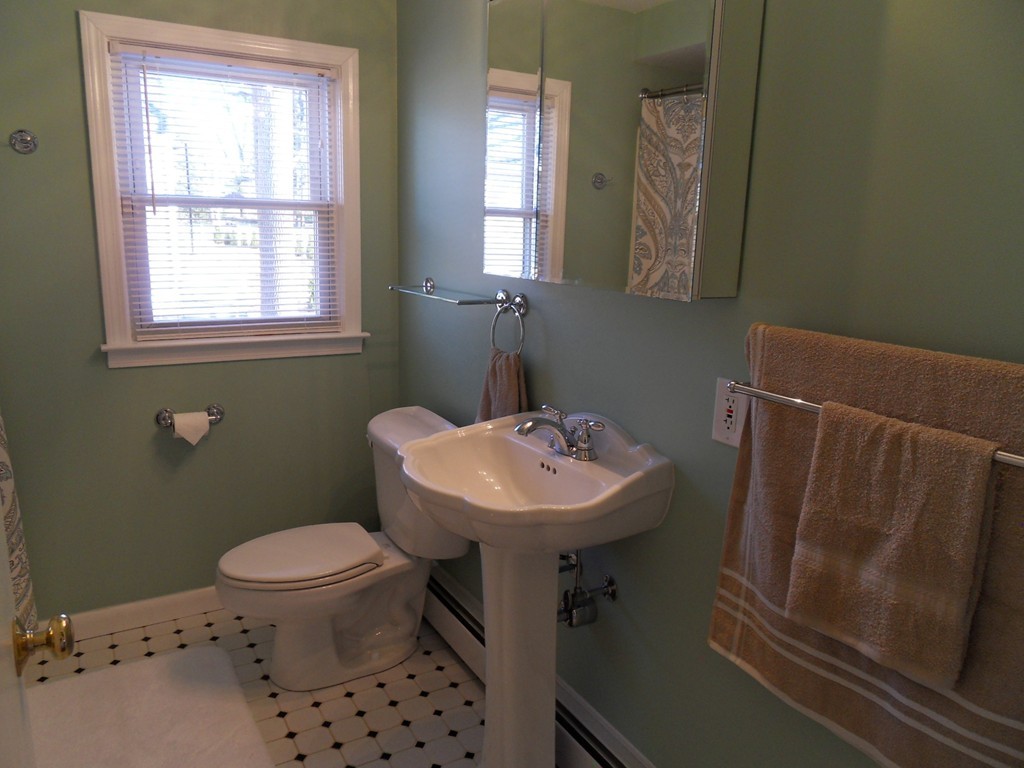 285 Thompson Road Webster, MA 01570 - Photo 16 of 20 a bathroom with a sink a toilet and a mirror