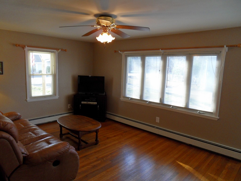 285 Thompson Road Webster, MA 01570 - Photo 10 of 20 a living room with furniture and a flat screen tv