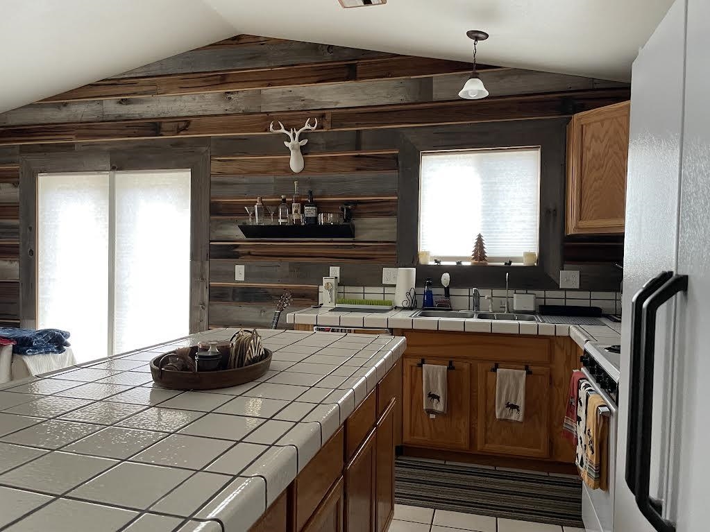 1154 Rocky Cliff Road Portola, CA 96122 - Photo 6 of 15 a kitchen with a sink and cabinets
