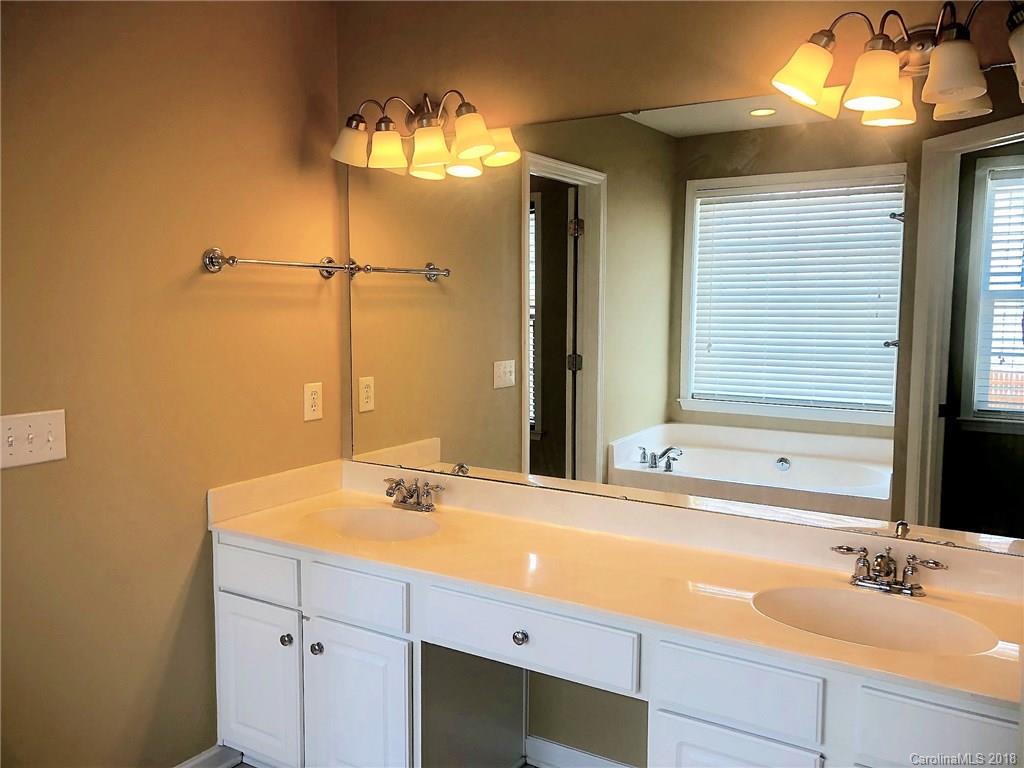 2401 Coltsgate Road Waxhaw, NC 28173 - Photo 11 of 22 a bathroom with a sink and a mirror