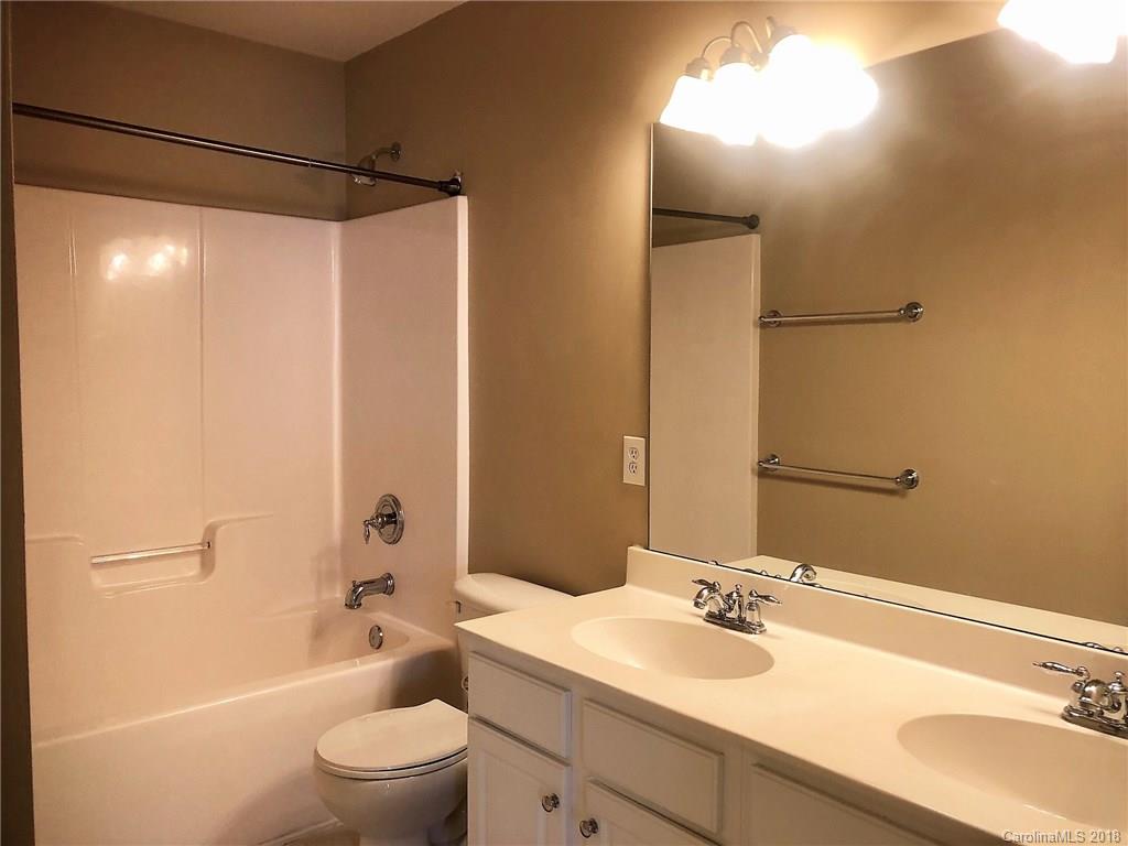 2401 Coltsgate Road Waxhaw, NC 28173 - Photo 15 of 22 a bathroom with a sink a toilet and shower