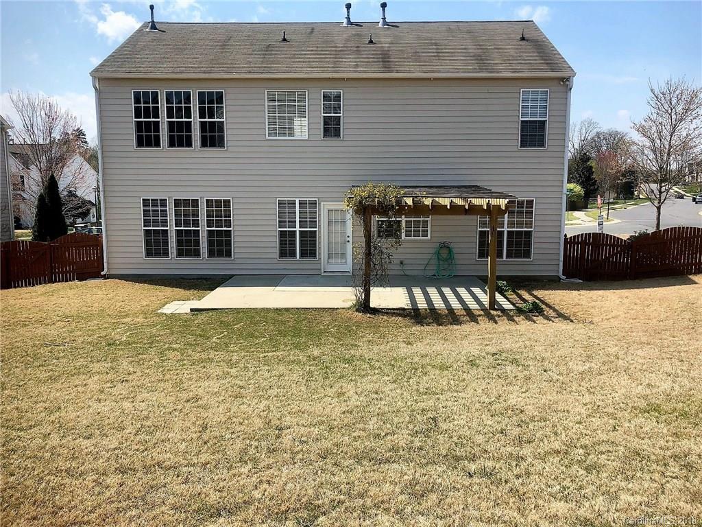 2401 Coltsgate Road Waxhaw, NC 28173 - Photo 20 of 22 a view of a house with a yard