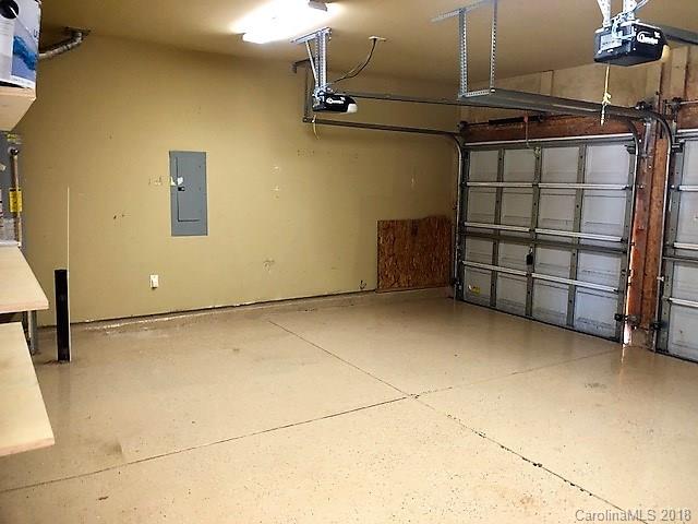 2401 Coltsgate Road Waxhaw, NC 28173 - Photo 21 of 22 a view of a garage with racks