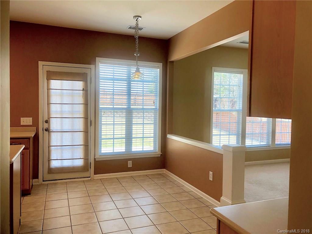 2401 Coltsgate Road Waxhaw, NC 28173 - Photo 8 of 22 a view of an empty room with a window
