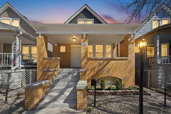 a front view of a house with seating space