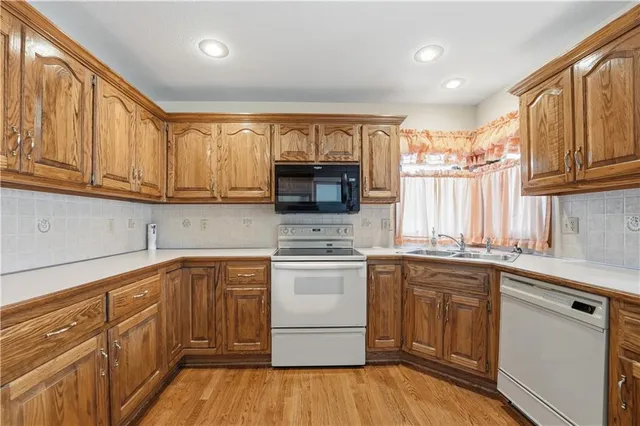 $350,000 | 105 North Lakeshore Drive, Raymore, MO 64083