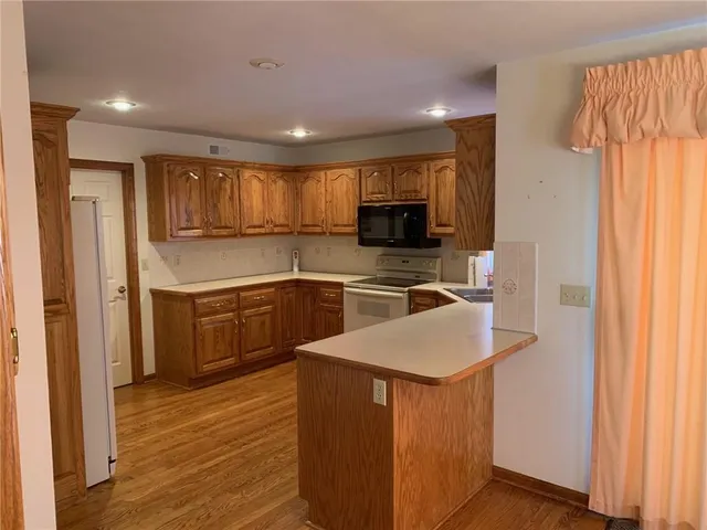 $350,000 | 105 North Lakeshore Drive, Raymore, MO 64083