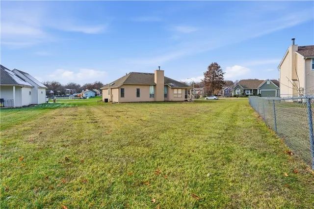 $350,000 | 105 North Lakeshore Drive, Raymore, MO 64083