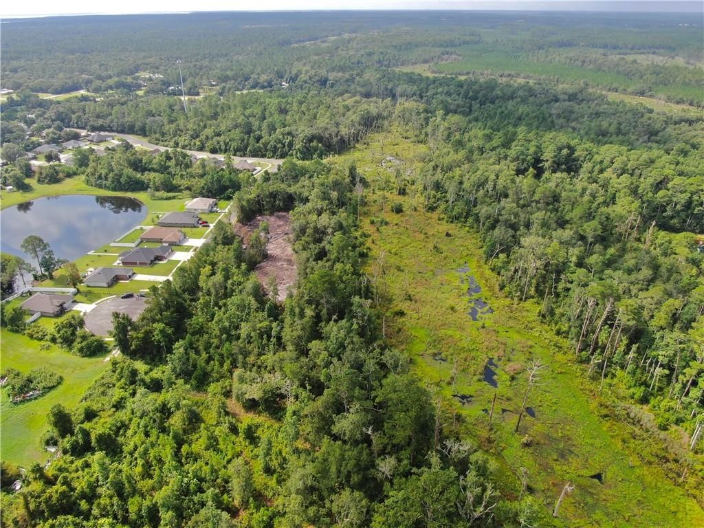 0 Villa Lane Yulee, FL 32097 - Photo 10 of 11 an aerial view of residential houses with outdoor space and trees