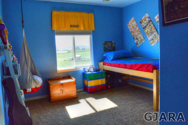 1575 15 Road Loma, CO 81524 - Photo 13 of 30 a bedroom with bed and window
