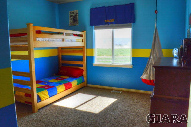 1575 15 Road Loma, CO 81524 - Photo 14 of 30 a bedroom with a bed and a window