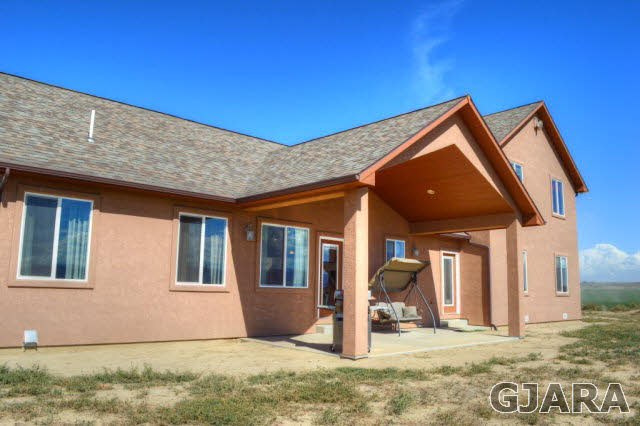 1575 15 Road Loma, CO 81524 - Photo 27 of 30 a front view of a house with a yard